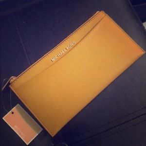 Michael Kors mustard yellow wallet. Brand new.